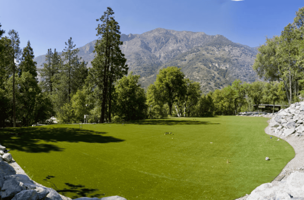 Outdoor turf green field in the mountains at Forest Home